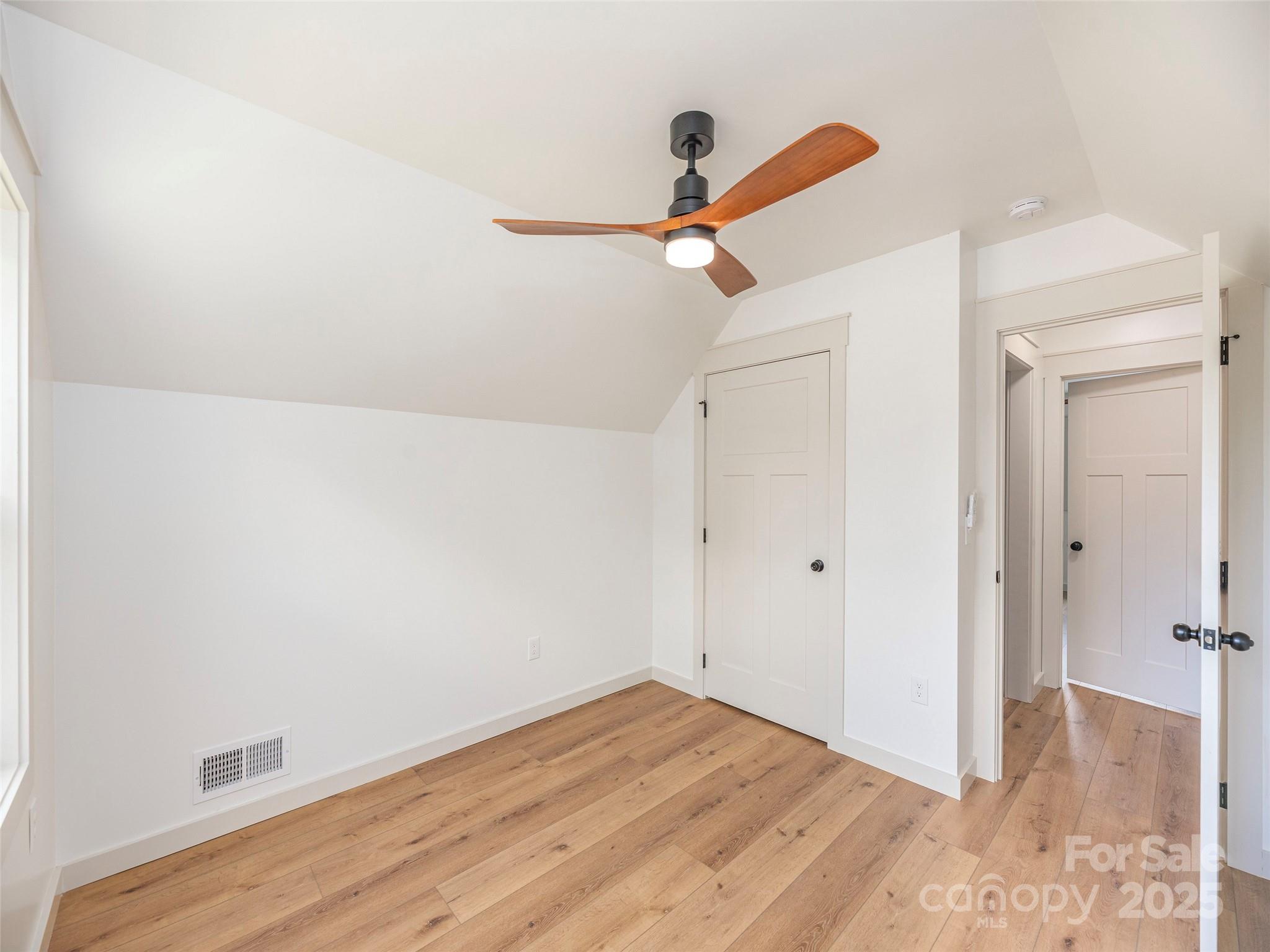 93 Cresthaven Drive Clyde, NC 28721 - Photo 24 of 27 a view of a room with wooden floor and cabinet