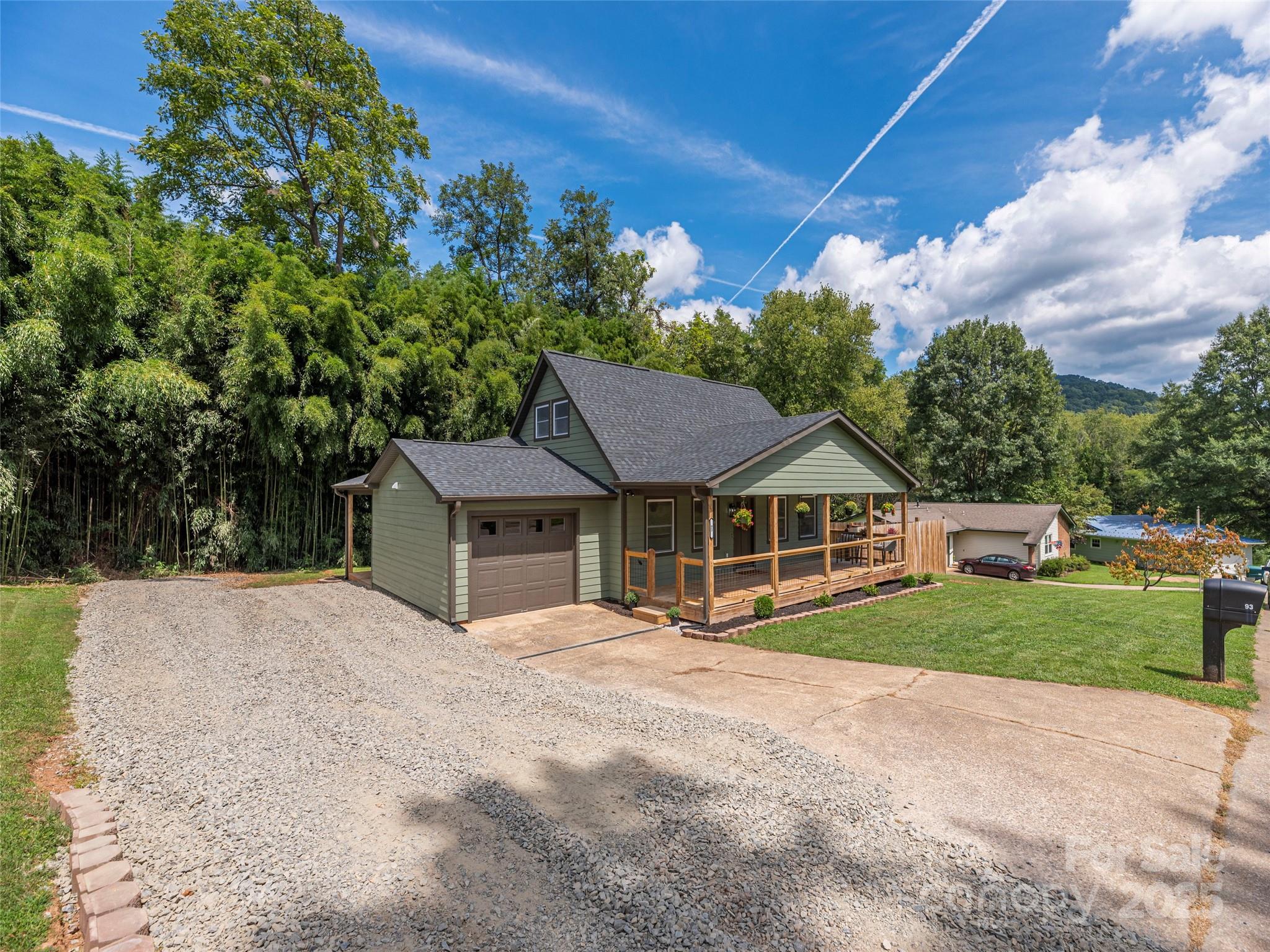 93 Cresthaven Drive Clyde, NC 28721 - Photo 27 of 27 a view of a house with a yard and potted plants