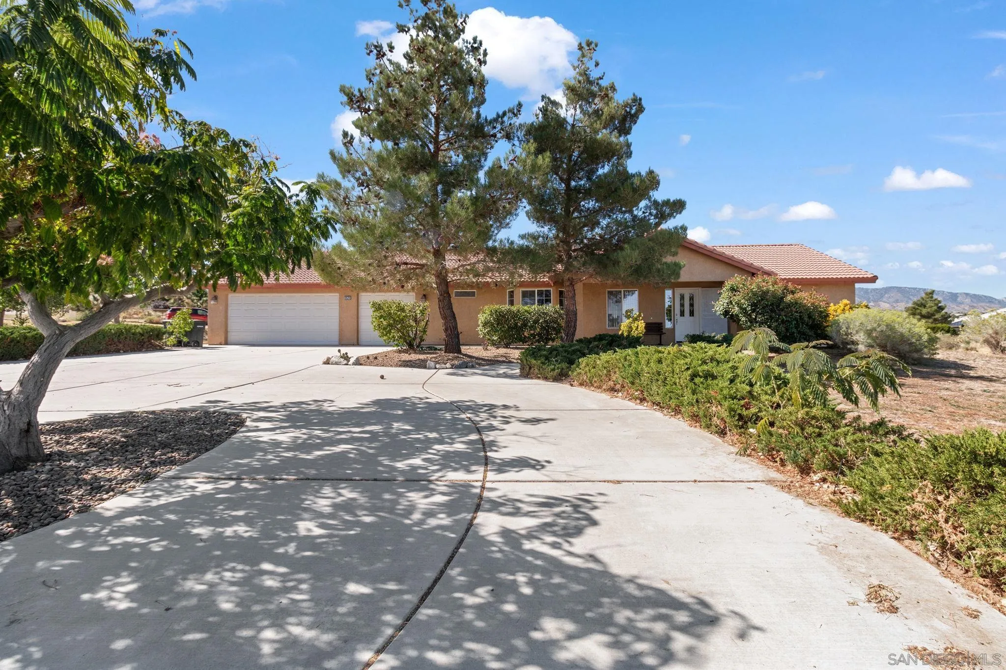 9520 Lebec Road Phelan, CA 92371 - Photo 1 of 27 a pathway of a house with a yard