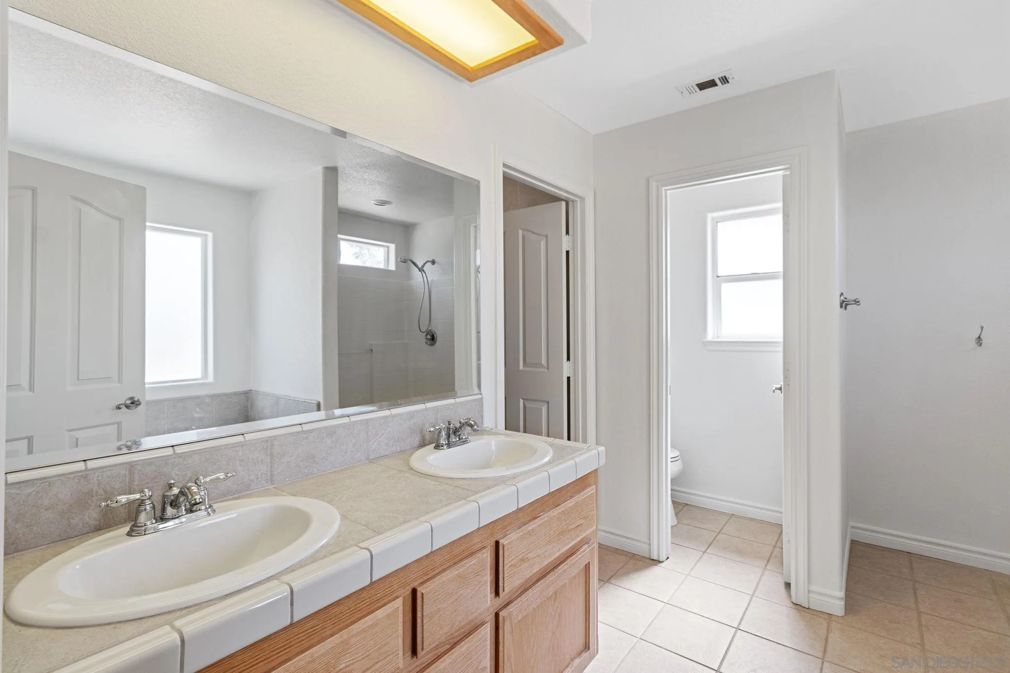 9520 Lebec Road Phelan, CA 92371 - Photo 15 of 27 a bathroom with a sink and a mirror