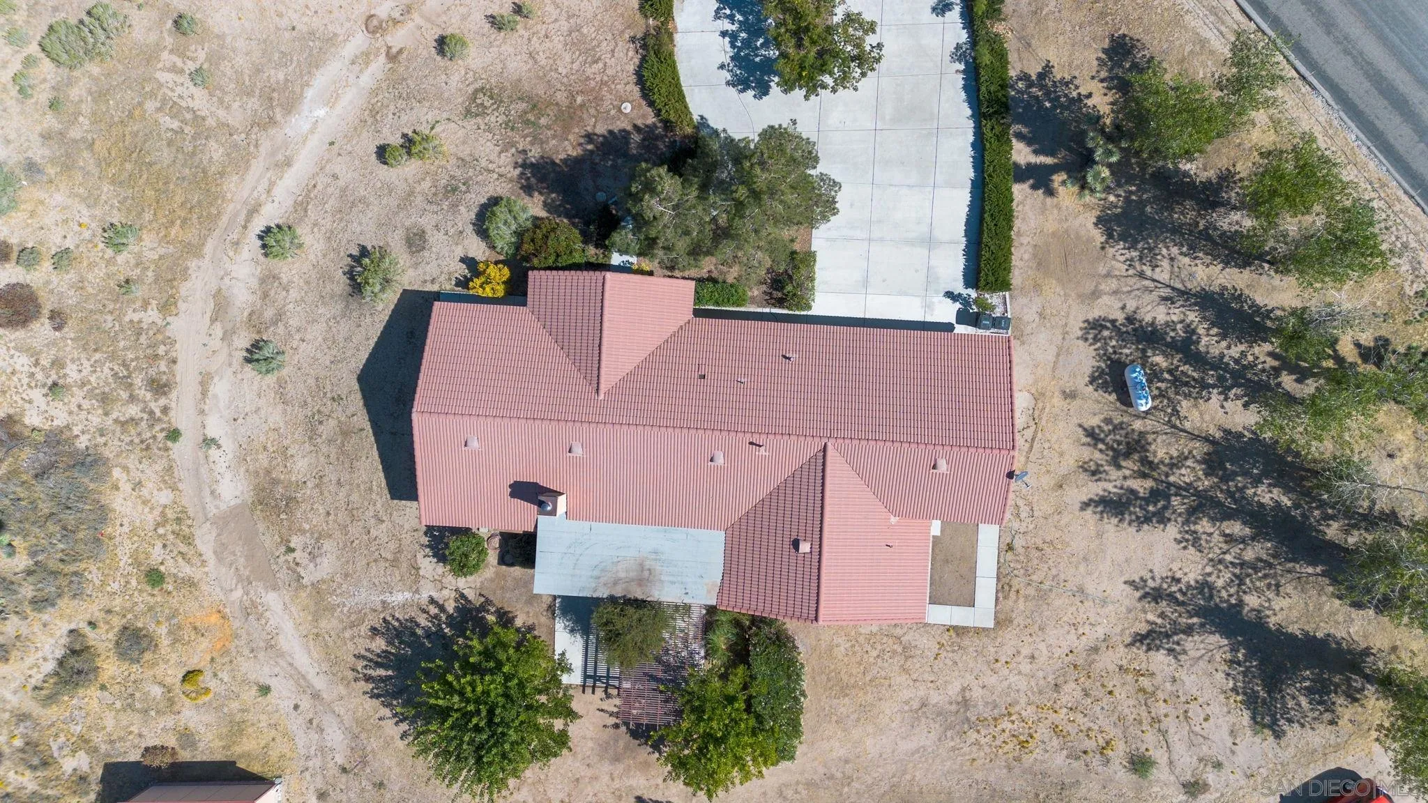 9520 Lebec Road Phelan, CA 92371 - Photo 21 of 27 an aerial view of a house with a yard and a large tree
