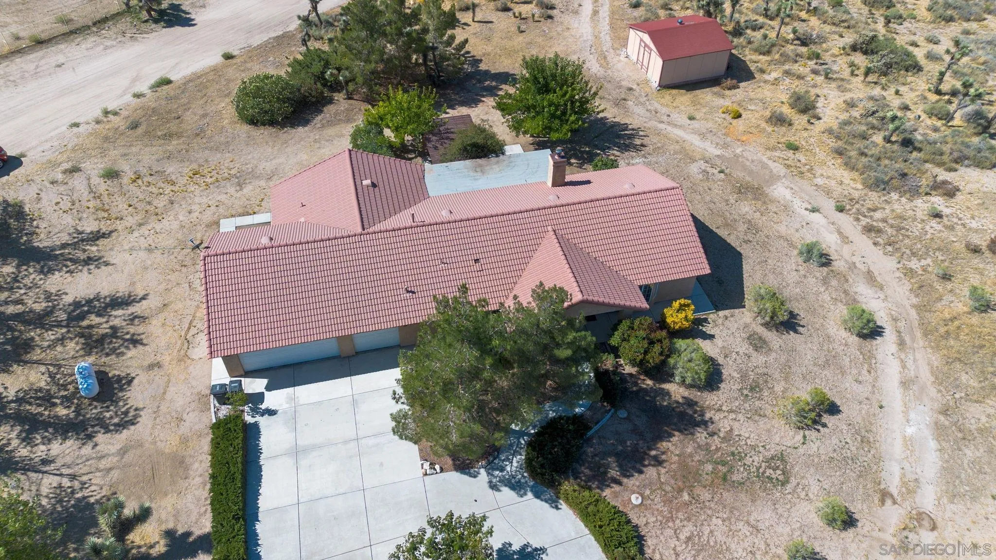 9520 Lebec Road Phelan, CA 92371 - Photo 24 of 27 a aerial view of a house with a yard and garden