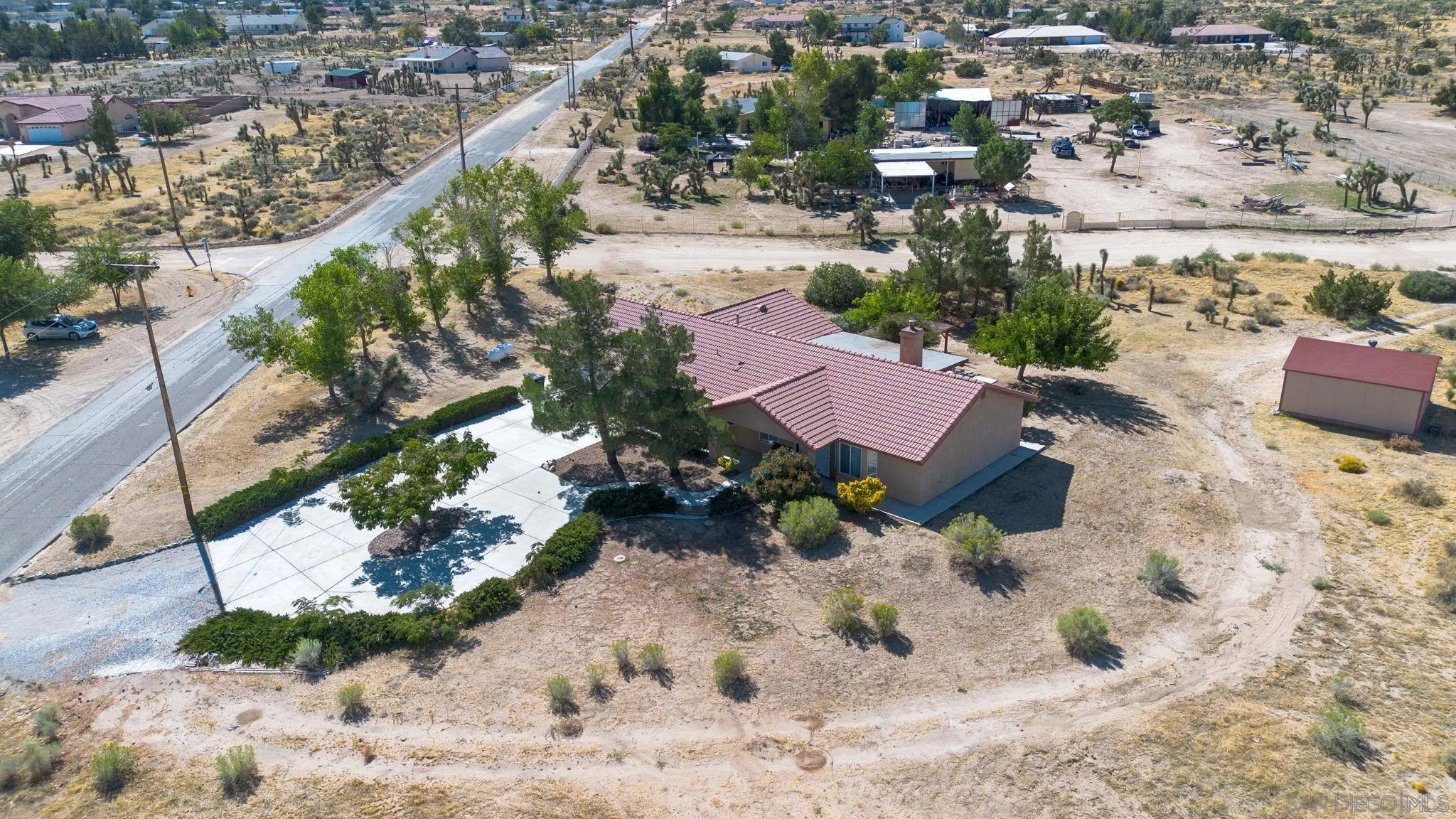 9520 Lebec Road Phelan, CA 92371 - Photo 26 of 27 an aerial view of a house with a yard and lake