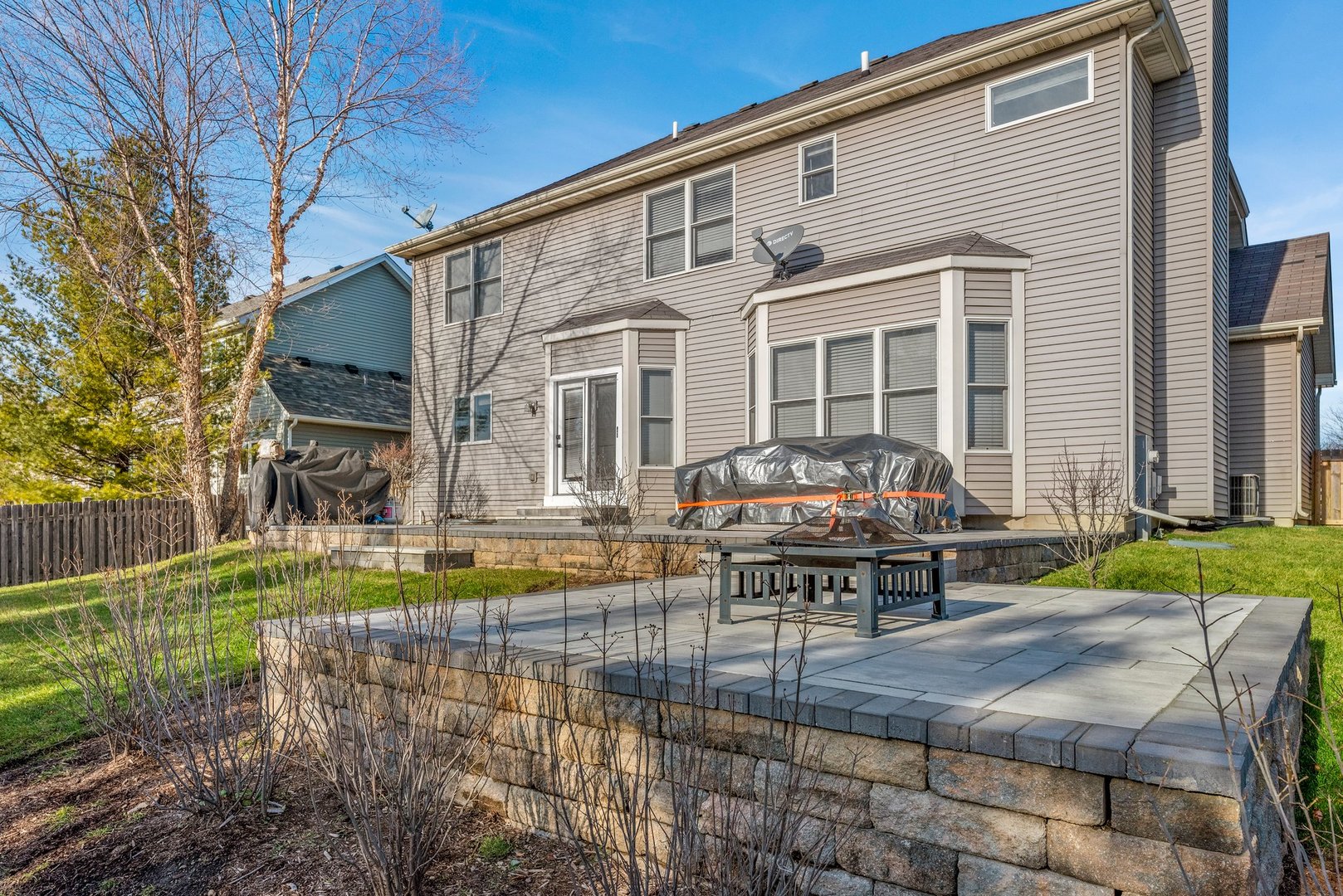 184 Prescott Drive Bartlett, IL 60103 - Photo 26 of 30 a front view of a house with garden and sitting area