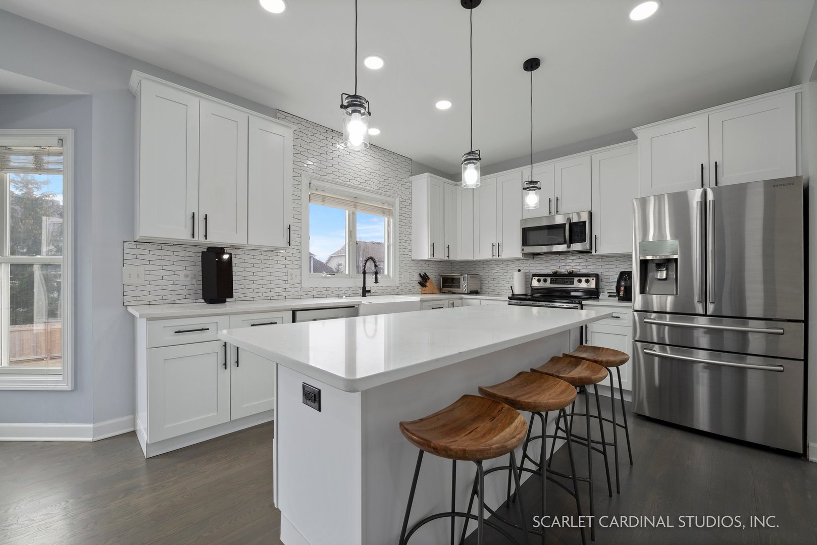 184 Prescott Drive Bartlett, IL 60103 - Photo 7 of 30 a kitchen with stainless steel appliances white cabinets a sink a stove a refrigerator and island