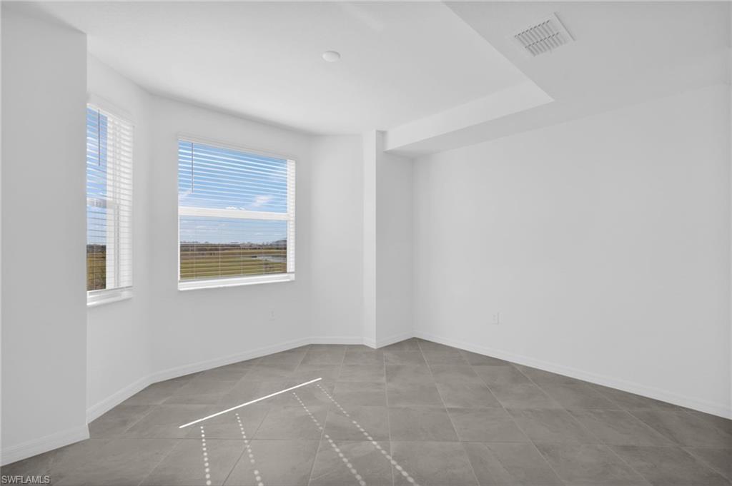 15375 Grn Acrs Avenue, Unit 2227 Babcock Ranch, FL 33982 - Photo 6 of 22 a view of an empty room with a window