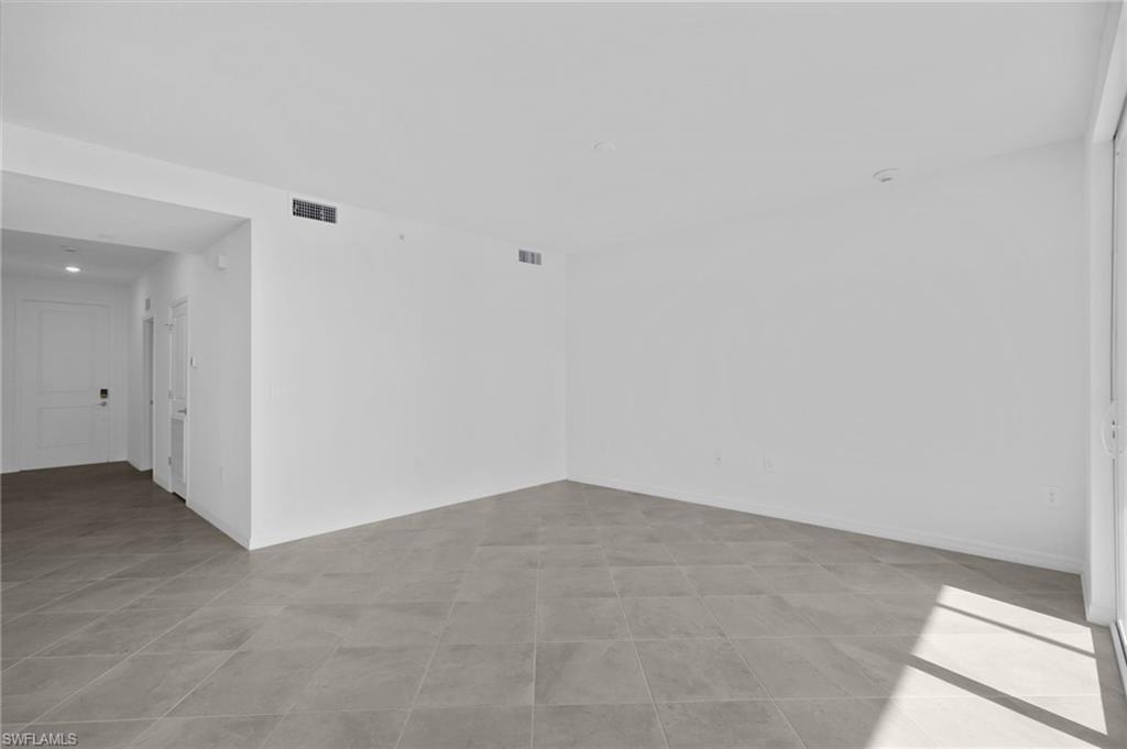 15375 Grn Acrs Avenue, Unit 2227 Babcock Ranch, FL 33982 - Photo 7 of 22 an empty room with an entryway