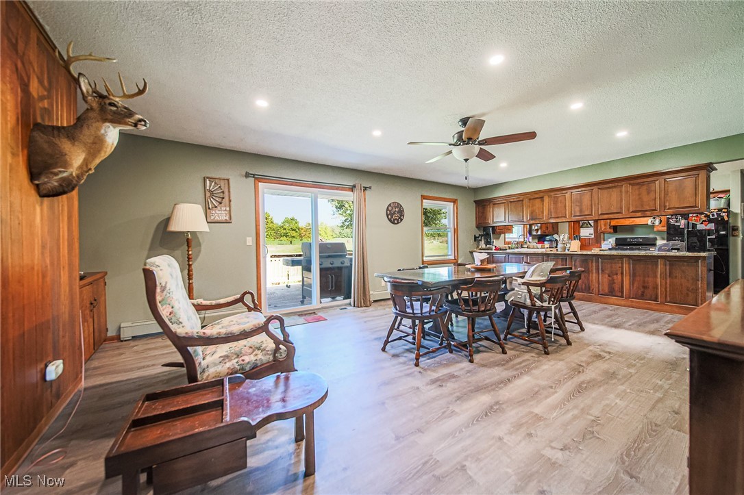1791 Beal Road Mansfield, OH 44903 - Photo 11 of 50 Dining room with a textured ceiling, recessed lighting, light wood-style floors, ceiling fan, and a baseboard heating unit