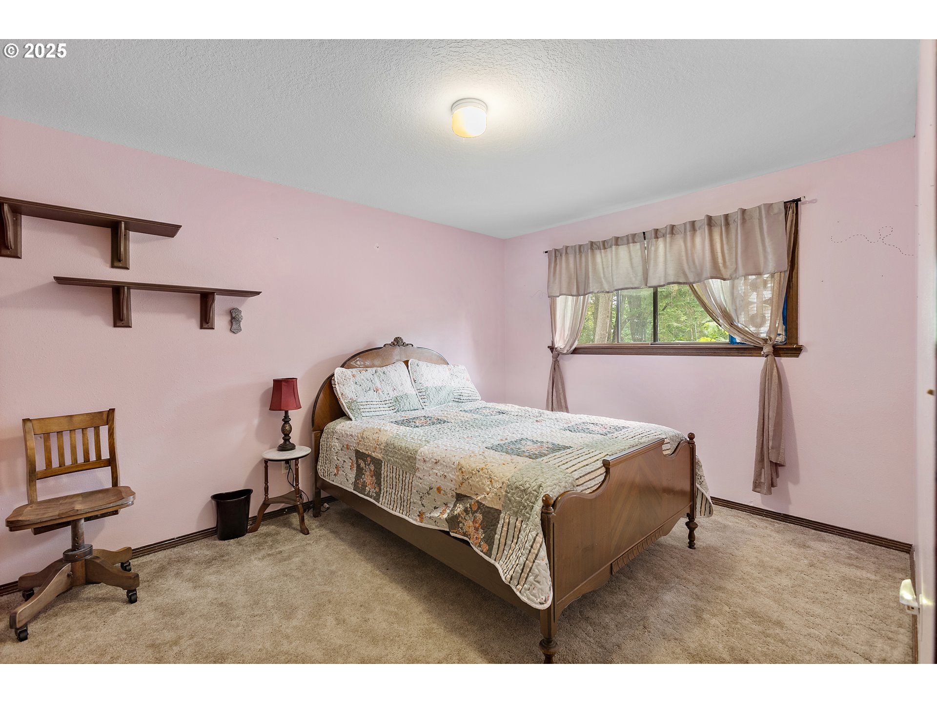 20154 Southeast Foster Road Damascus, OR 97089 - Photo 12 of 40 a spacious bedroom with a bed and a desk