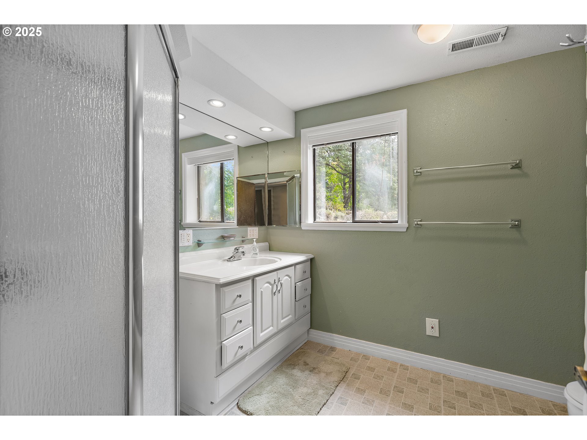 20154 Southeast Foster Road Damascus, OR 97089 - Photo 15 of 40 a bathroom with a sink vanity and mirror