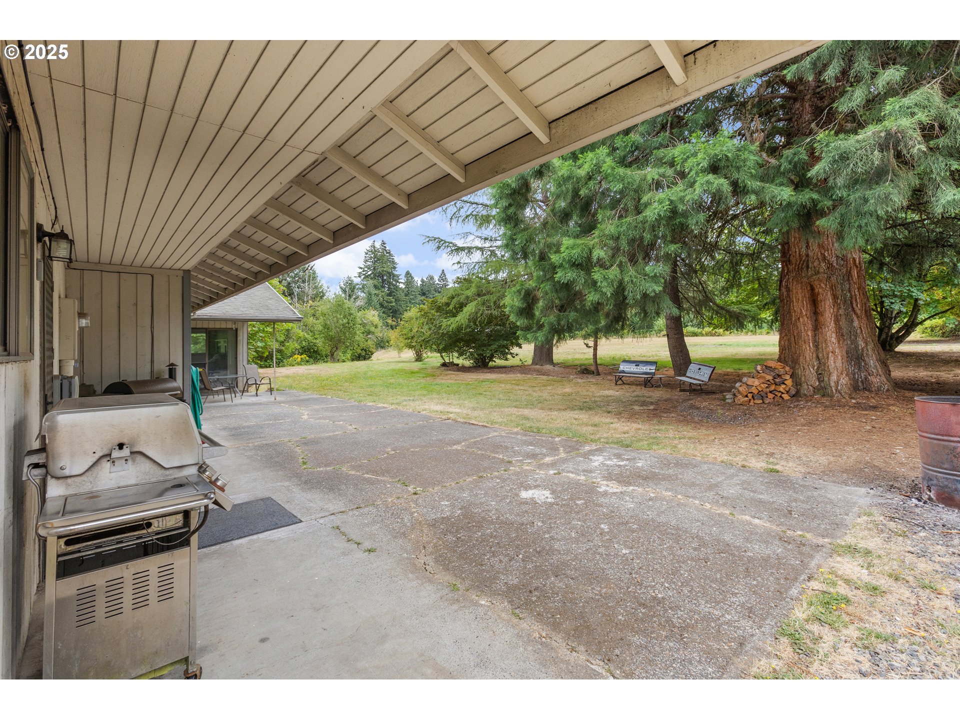 20154 Southeast Foster Road Damascus, OR 97089 - Photo 19 of 40 a view of a backyard with floor to ceiling window and tree