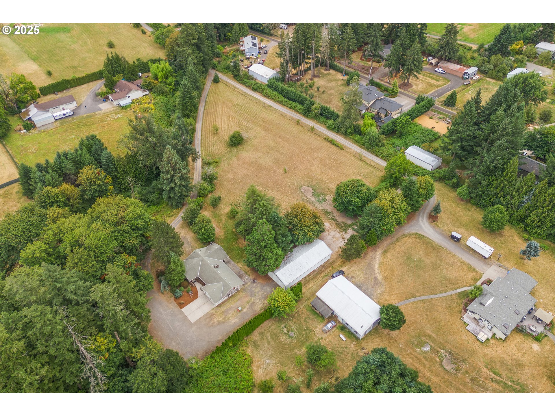 20154 Southeast Foster Road Damascus, OR 97089 - Photo 32 of 40 an aerial view of residential houses with outdoor space