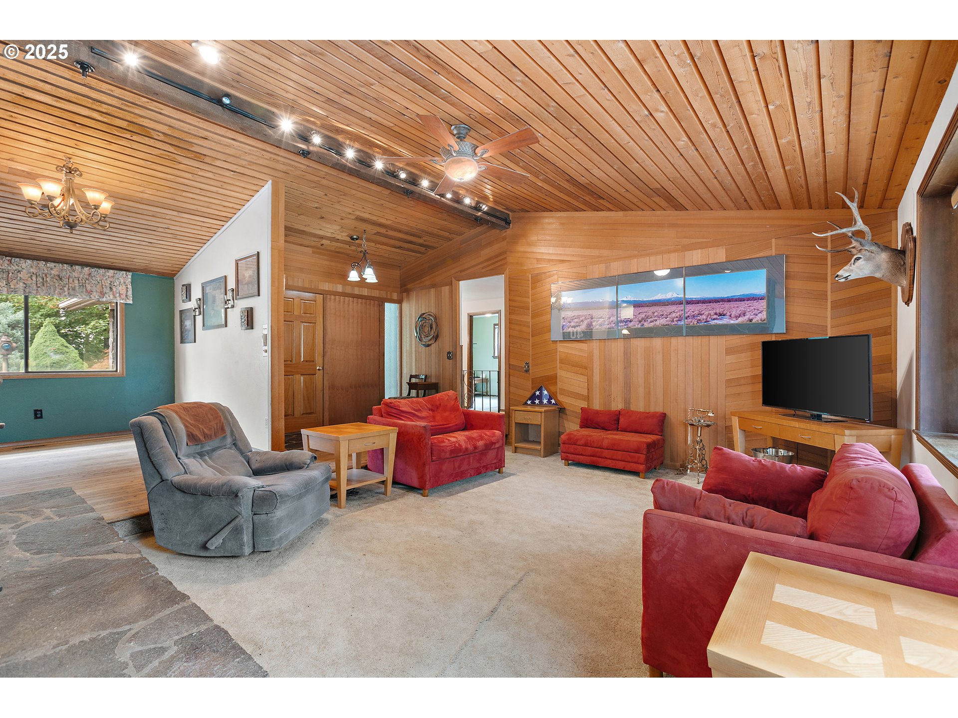 20154 Southeast Foster Road Damascus, OR 97089 - Photo 35 of 40 a living room with furniture and a flat screen tv