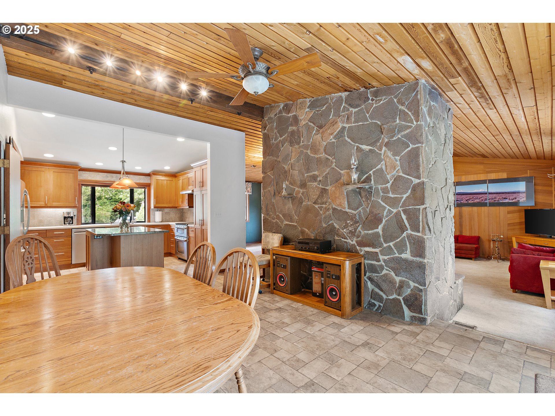 20154 Southeast Foster Road Damascus, OR 97089 - Photo 39 of 40 a living room with stainless steel appliances kitchen island granite countertop furniture and a fireplace