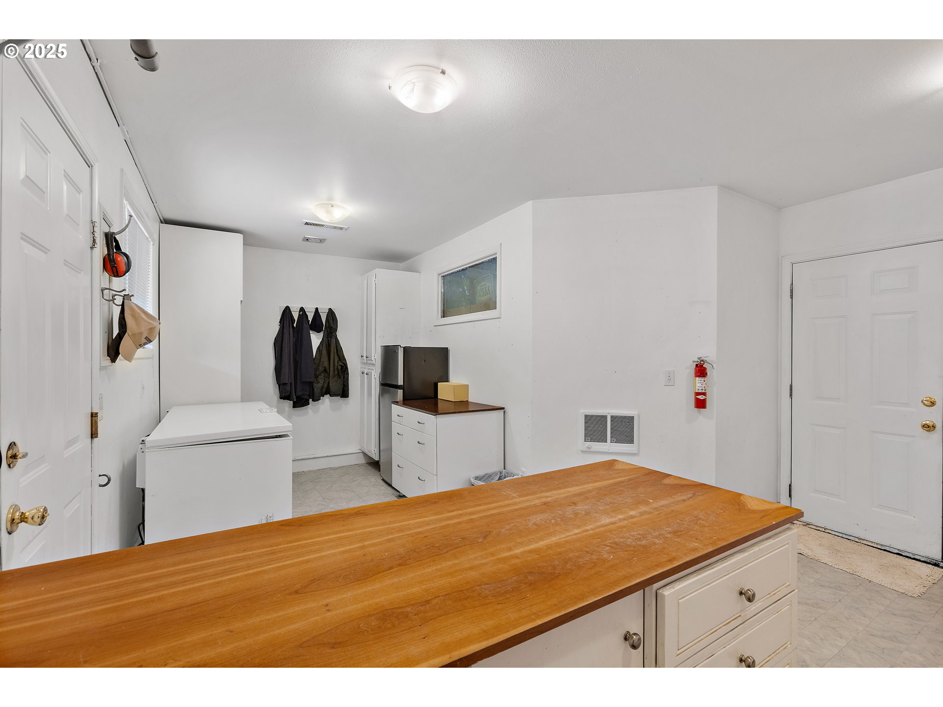 20154 Southeast Foster Road Damascus, OR 97089 - Photo 4 of 40 a bedroom with a bed and a white cabinets
