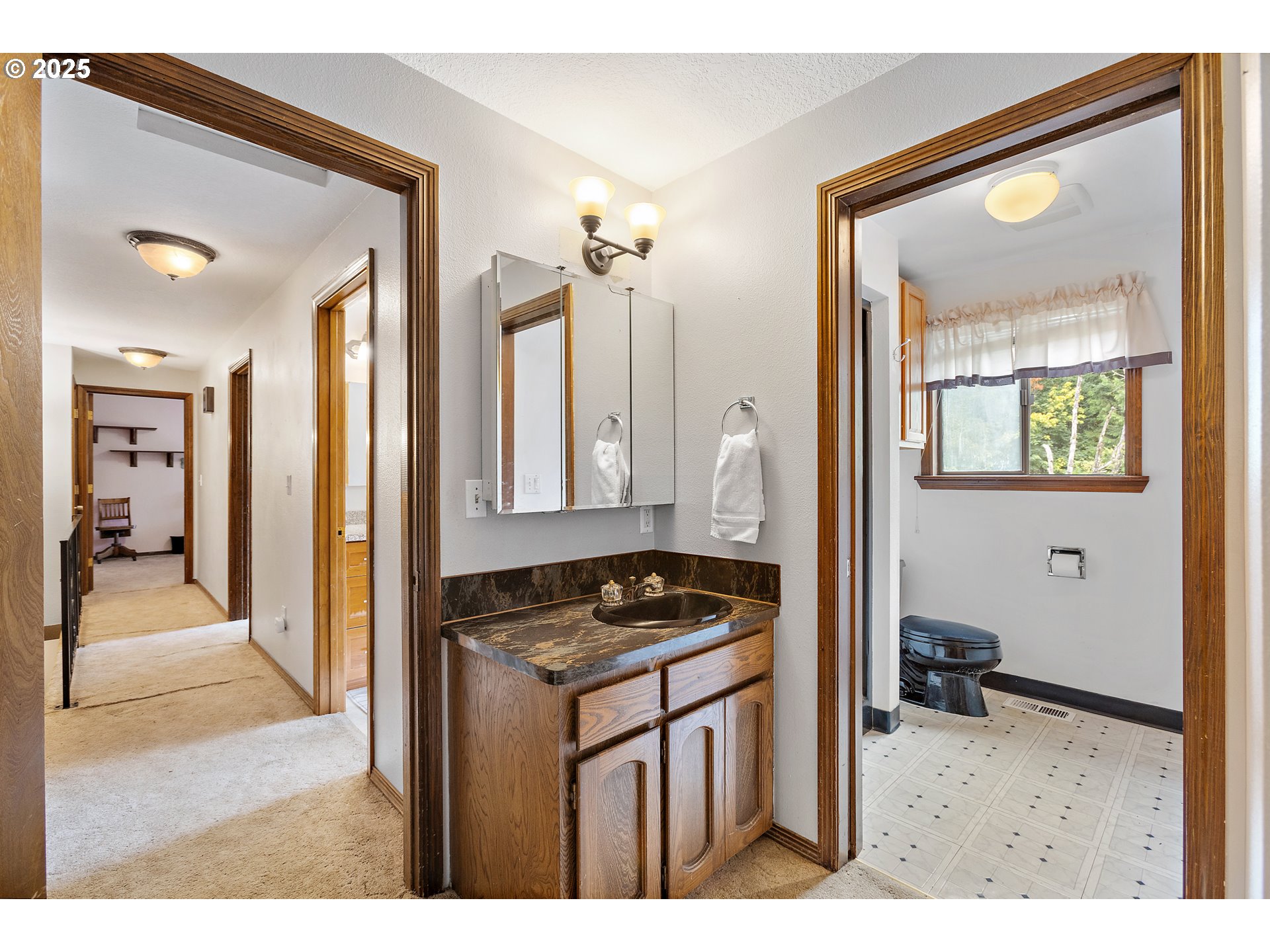 20154 Southeast Foster Road Damascus, OR 97089 - Photo 8 of 40 a kitchen view with granite countertop a sink and a stove with granite countertop