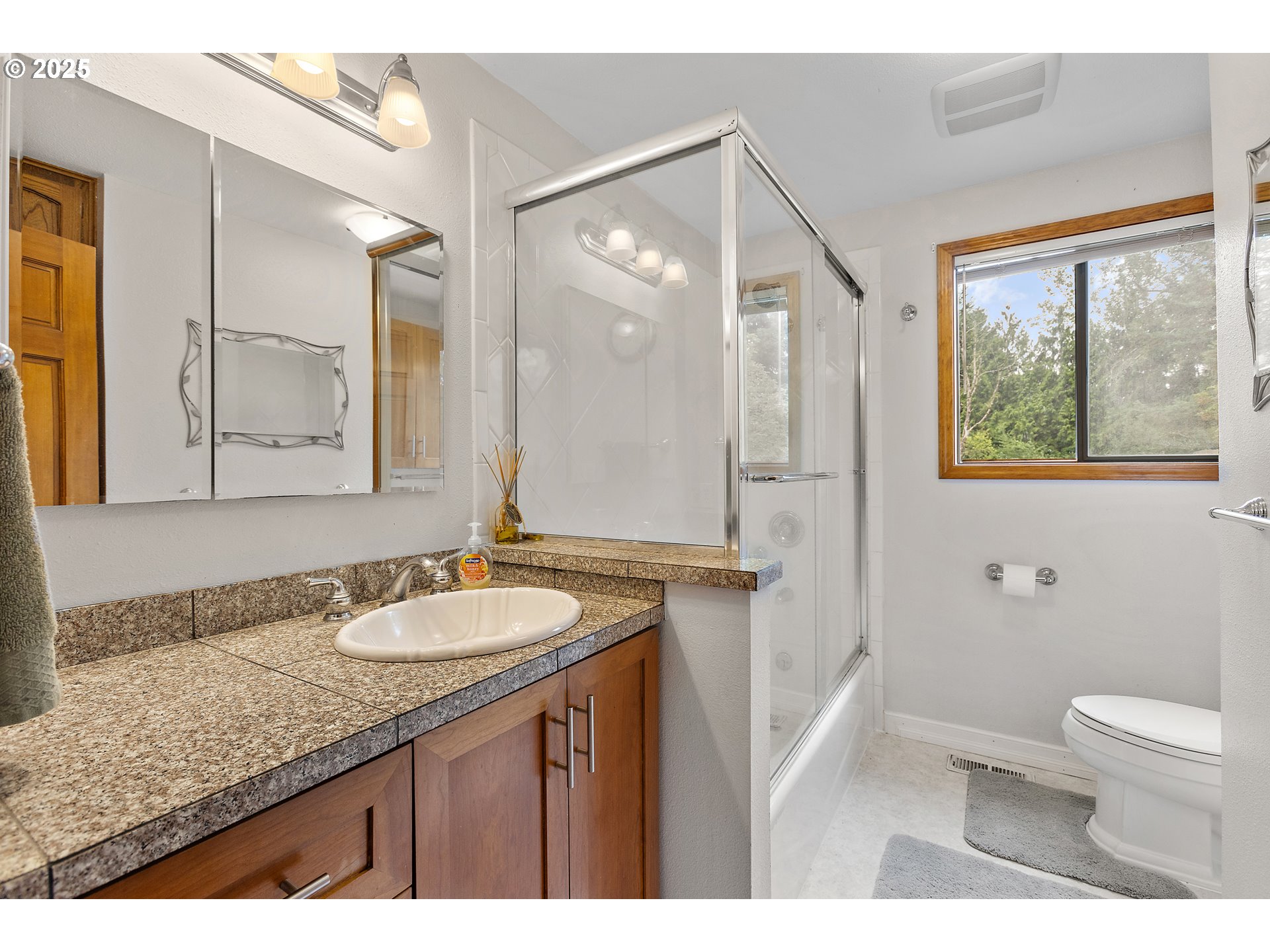 20154 Southeast Foster Road Damascus, OR 97089 - Photo 10 of 40 a bathroom with a granite countertop sink toilet and shower
