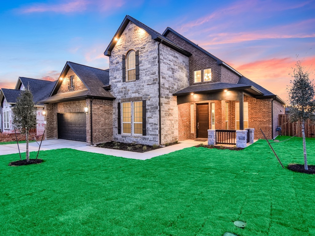 274 Wild Pecan Loop Buda, TX 78610 - Photo 1 of 1 a front view of a house with a yard and porch