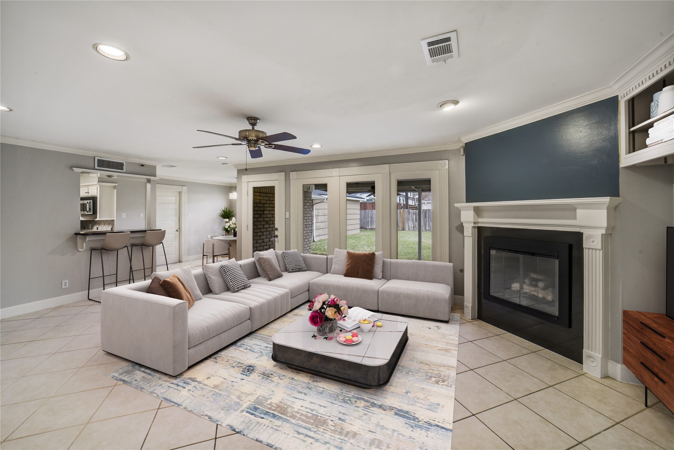 5322 Rutherglenn Drive Houston, TX 77096 - Photo 5 of 30 Never miss a moment of family time with views from the kitchen to living room. Bar seating for entertaining and plenty of room for large sectional. *virtually staged*