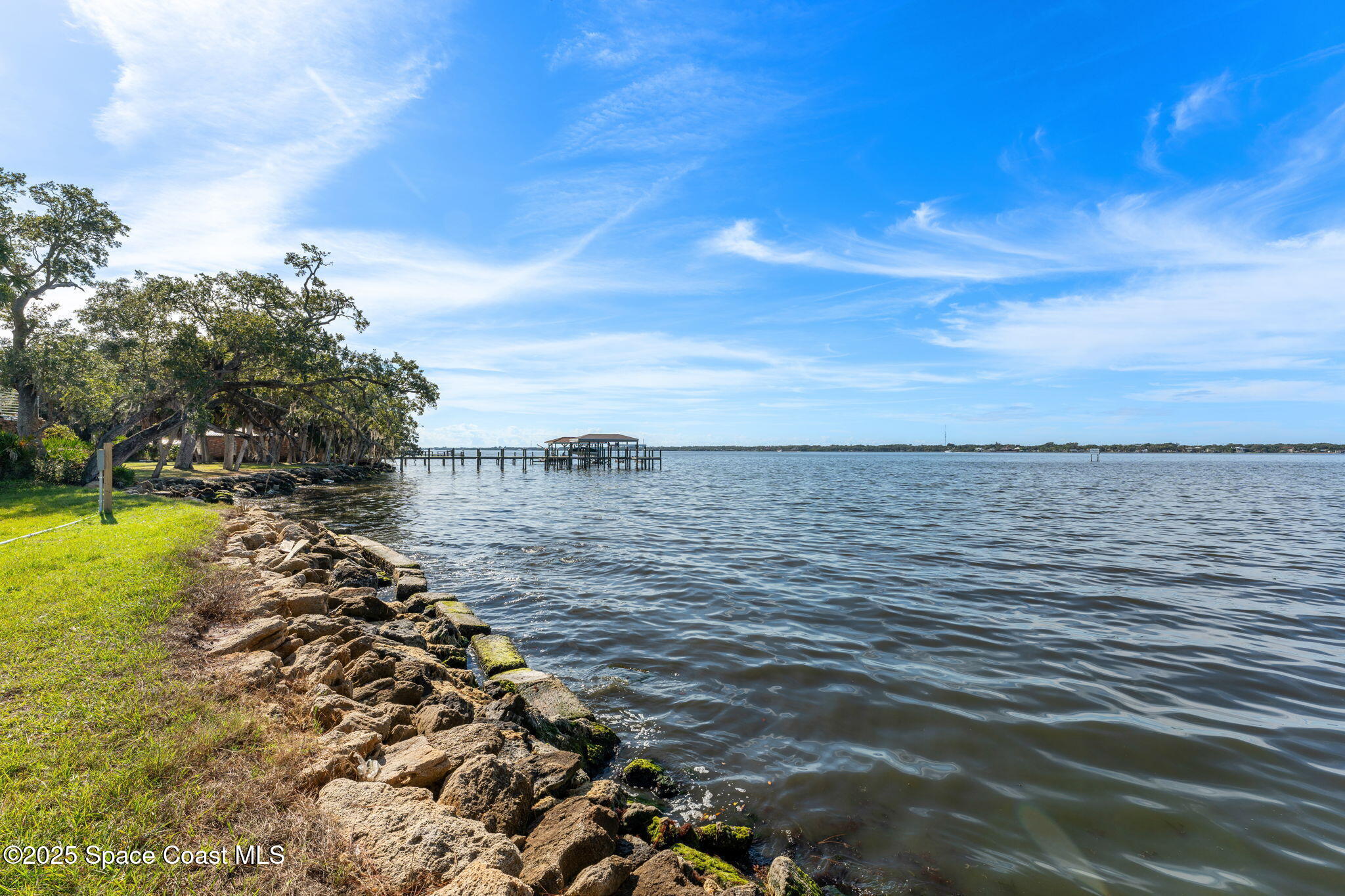 0 Crooked Mile Road Merritt Island, FL 32952 - Photo 6 of 29 a large body of water with a building in the background