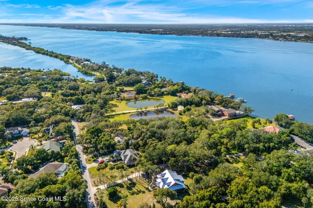 a view of a large body of water with a building in the background