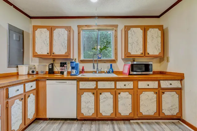 a kitchen with a window a sink and a counter top space