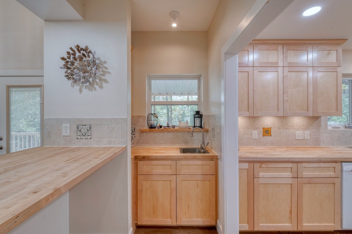 123 Bowie Trail Luling, TX 78648 - Photo 13 of 39 a kitchen with white cabinets and sink