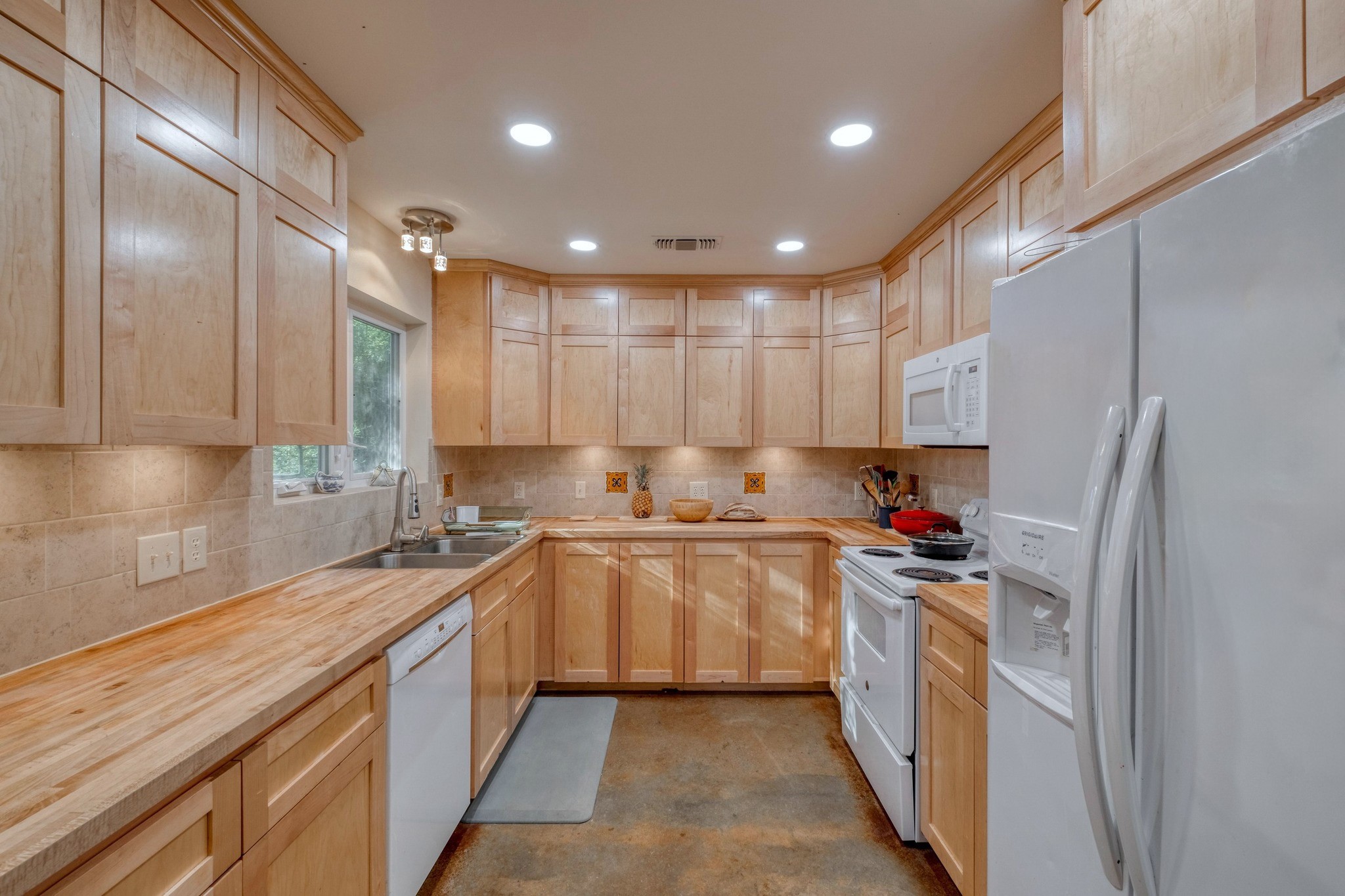 123 Bowie Trail Luling, TX 78648 - Photo 14 of 39 a kitchen with a sink stainless steel appliances and cabinets