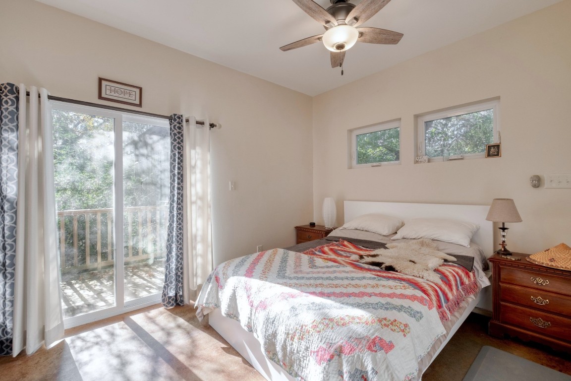 123 Bowie Trail Luling, TX 78648 - Photo 16 of 39 a bedroom with a large bed and a window