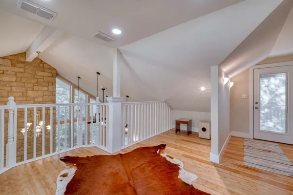 a balcony with wooden floor