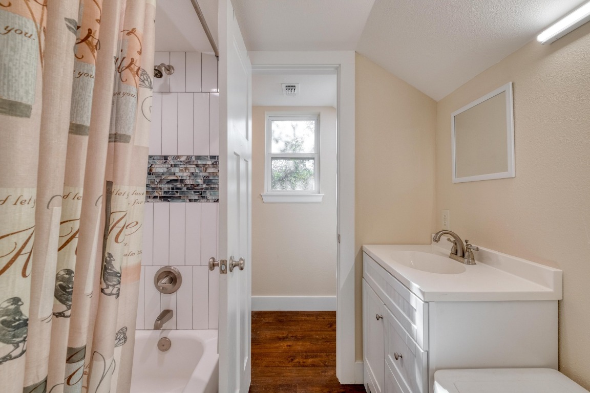 123 Bowie Trail Luling, TX 78648 - Photo 31 of 39 a bathroom with a sink a toilet and shower