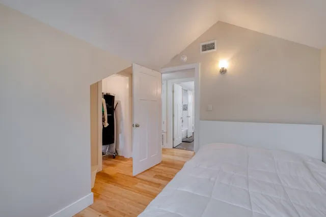 a view of a wooden fence and trees