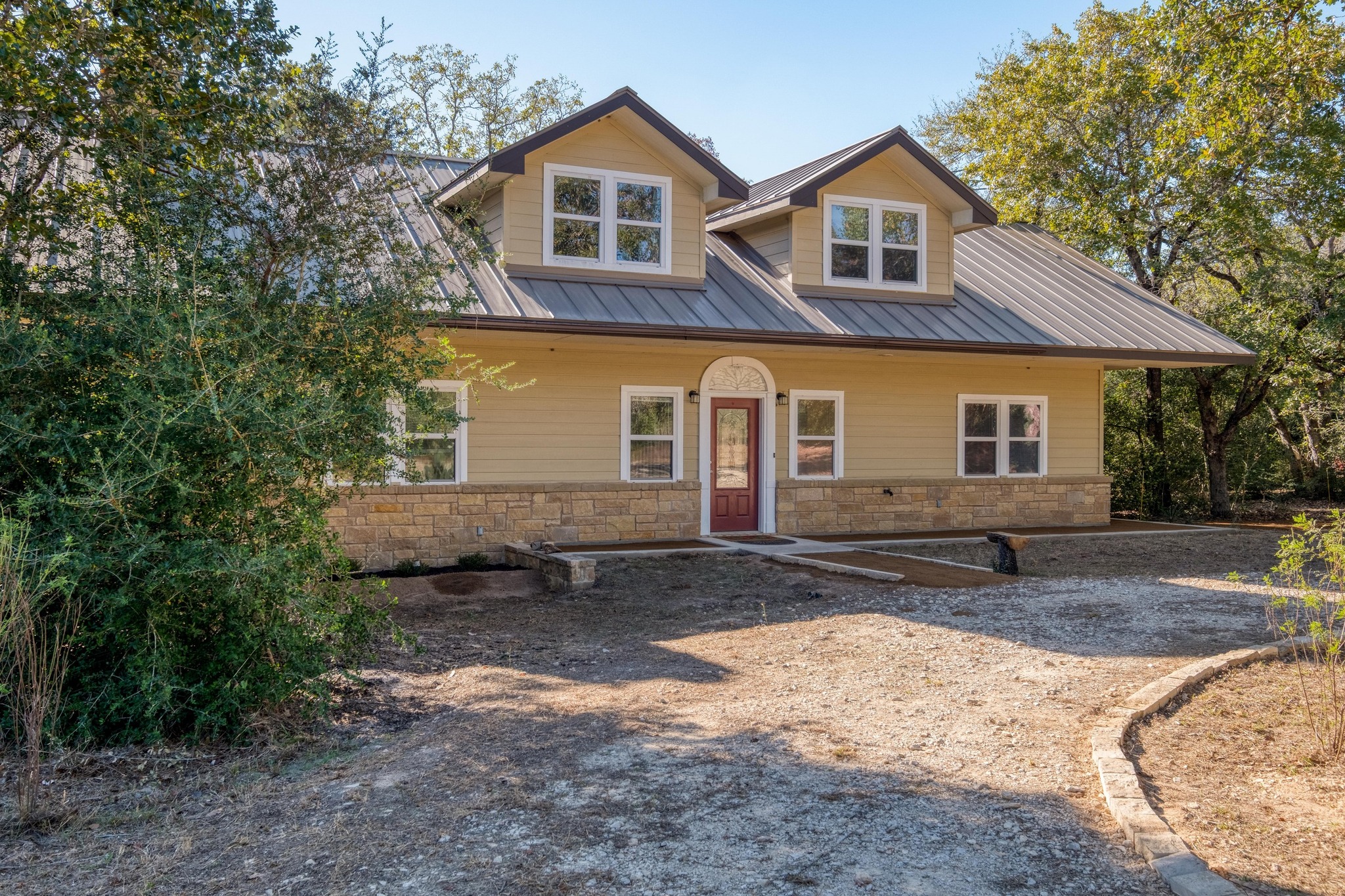 123 Bowie Trail Luling, TX 78648 - Photo 36 of 39 a front view of a house with a yard