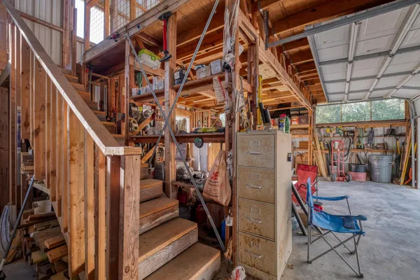 a view of a room with wooden ceiling