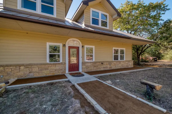 a front view of a house with a yard