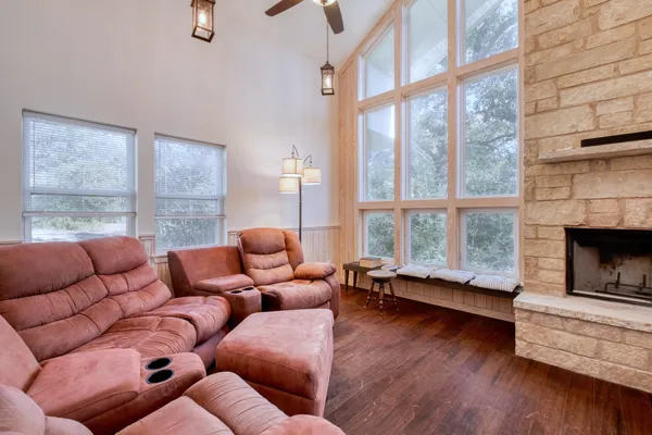 a living room with furniture and a fireplace