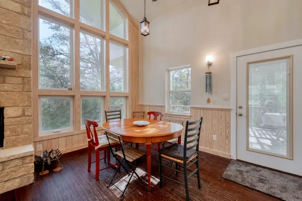 a view of a dining room with furniture and a window