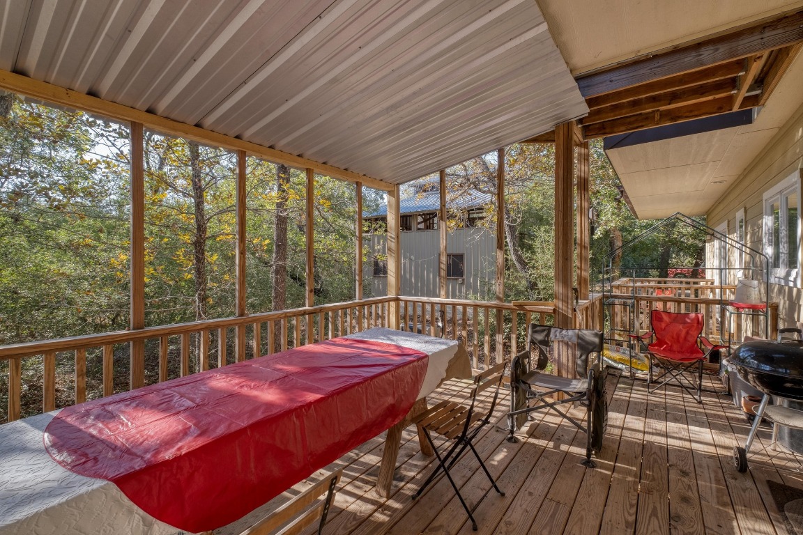 123 Bowie Trail Luling, TX 78648 - Photo 10 of 39 a view of a balcony with chair and wooden floor