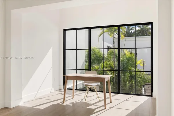 a bedroom with bed and window