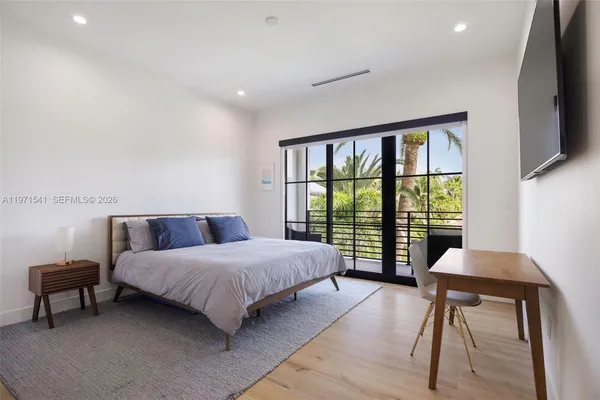 a bathroom with a toilet a sink and a mirror