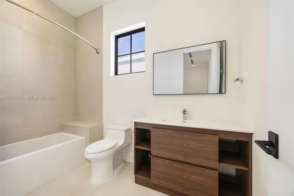 a building outdoor space with patio couches and pool