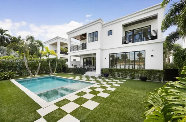 a view of yard with swimming pool and chair