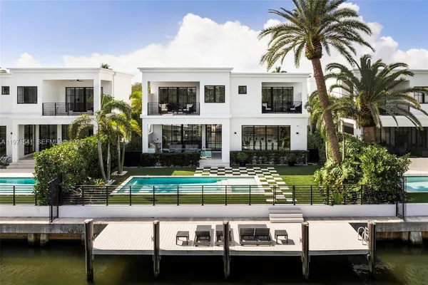 an aerial view of a house with a lake view