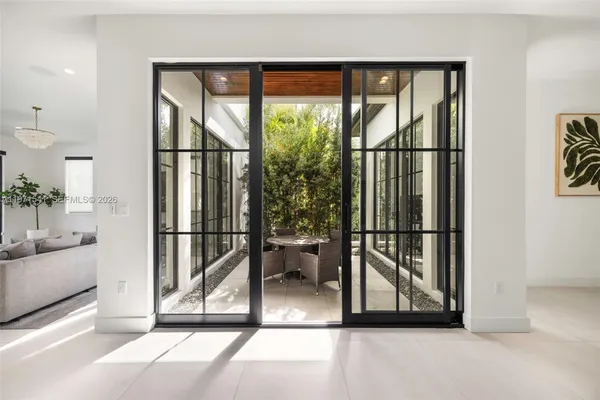 a view of a patio with a table chairs and a table