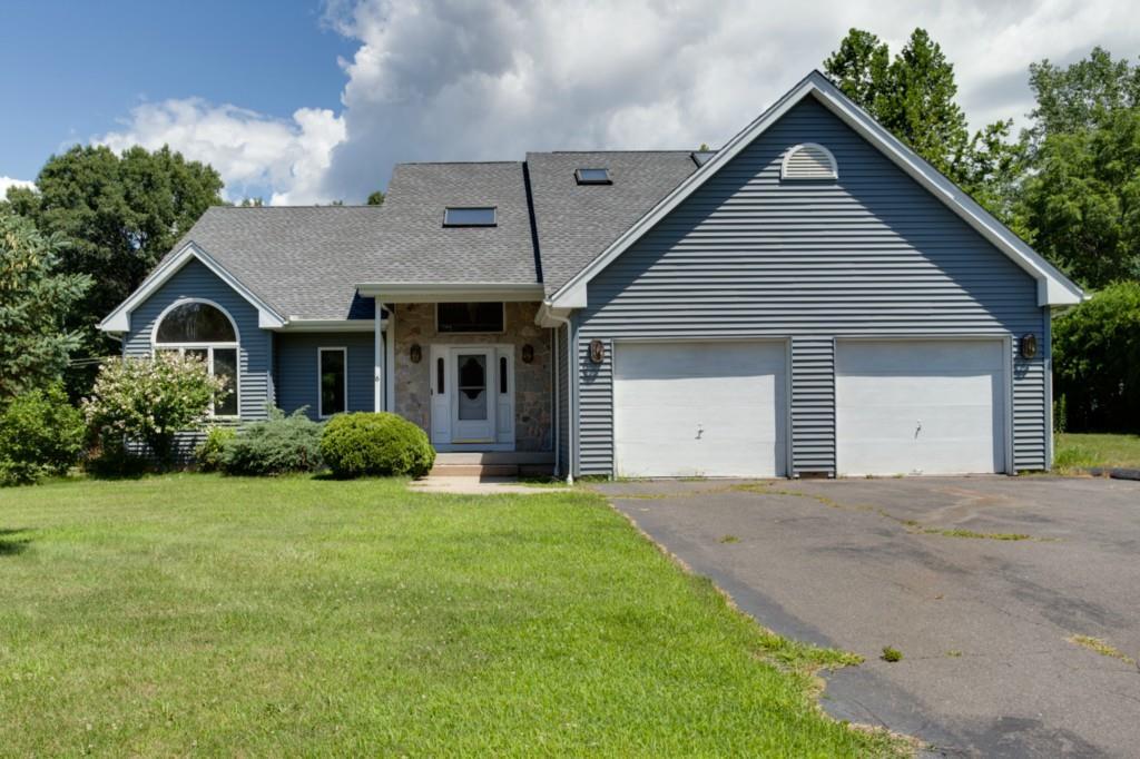 6 Sachem Road Plainville, CT 06062 - Photo 1 of 1 a front view of a house with a garden and yard