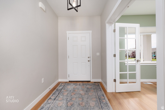 1654 South 730 West Provo, UT 84601 - Photo 3 of 33 Entryway featuring light-toned walls, wood-finish flooring, and a multi-pane glass French door