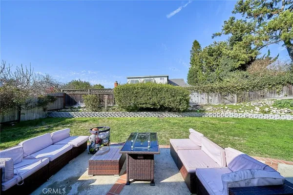 a view of a yard with furniture