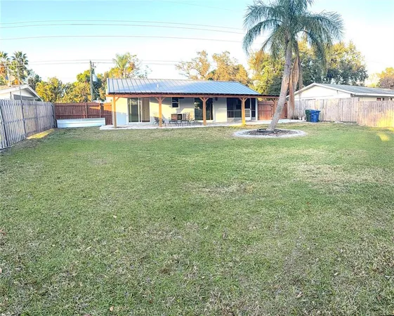 a view of house with outdoor space and swimming pool