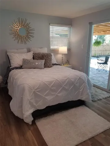 a bedroom with a bed and window