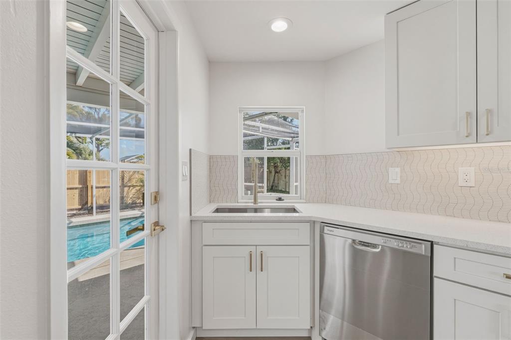 1330 Horizon Road Venice, FL 34293 - Photo 11 of 40 a kitchen with cabinets and window